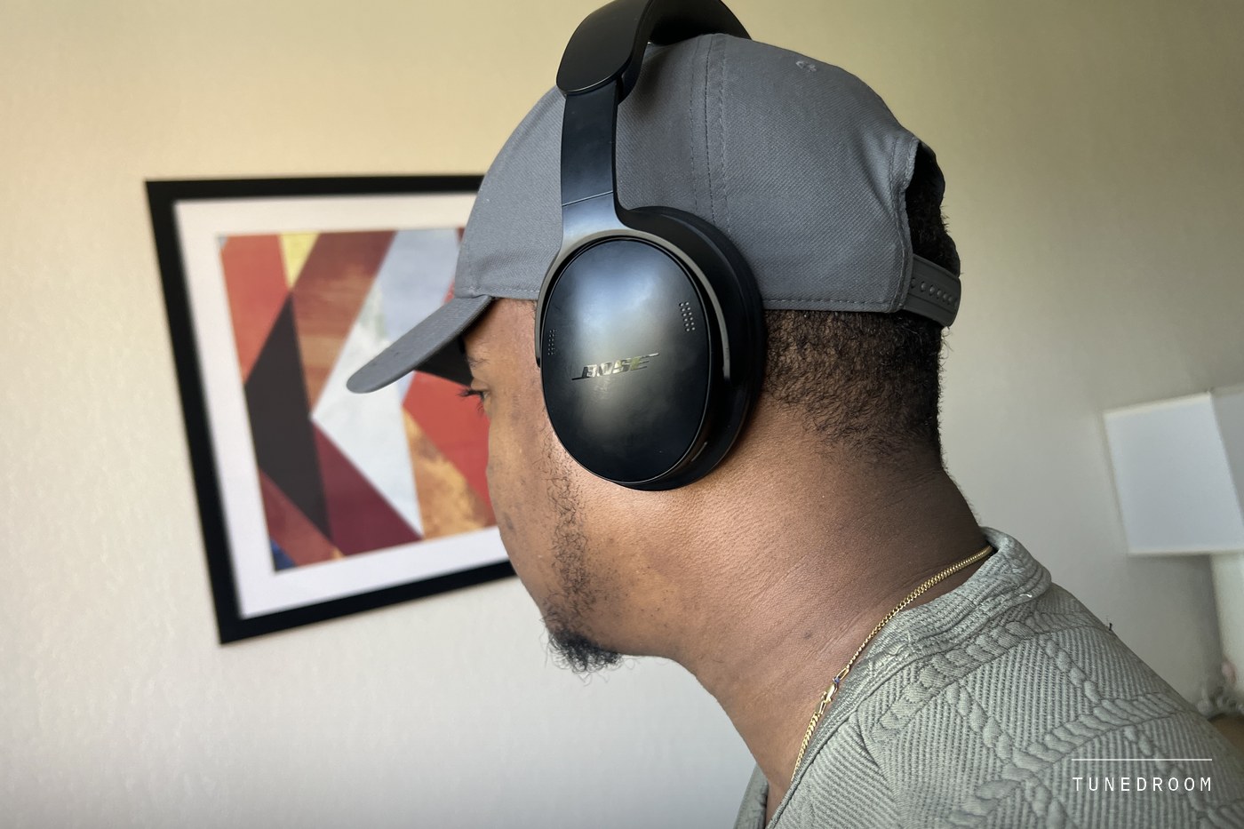Side profile of the headphones worn, showing how the earcup sits around the ear