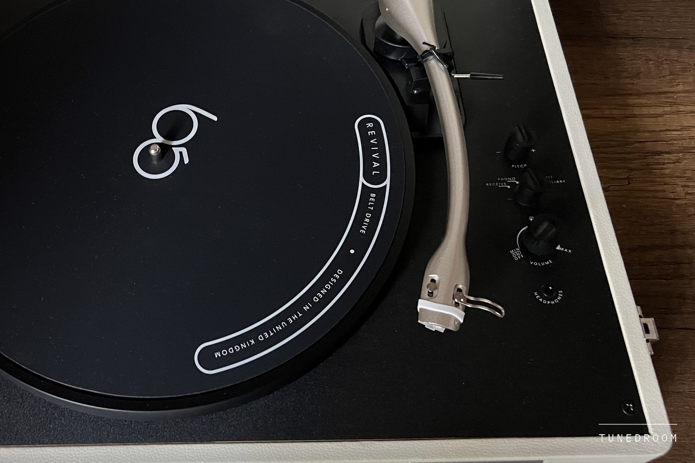 Looking down on the Revival 65's platter and S-shaped tonearm, the Audio-Technica cartridge at its tip, with the control knobs and headphone socket to the right
