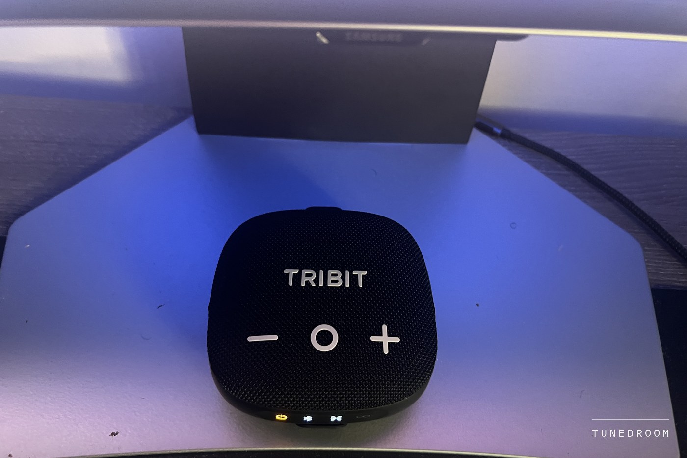 The Micro 3's grille and its edge button row with power, Bluetooth, XBass and TWS icons, the power light lit amber