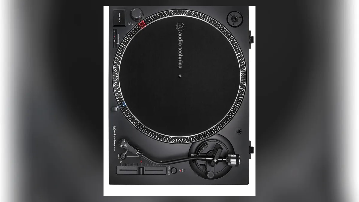 Black Audio Technica turntable viewed from above, showing the platter, tonearm, and pitch control.