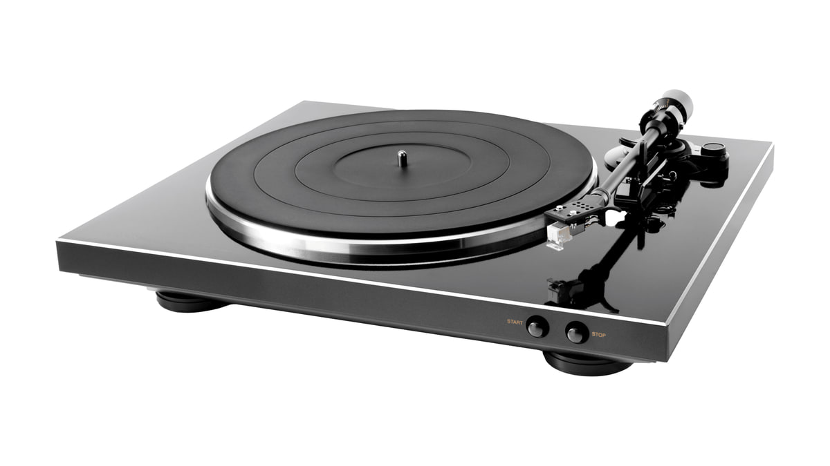 Black Denon DP300F turntable viewed from the front at an angle on a white background.