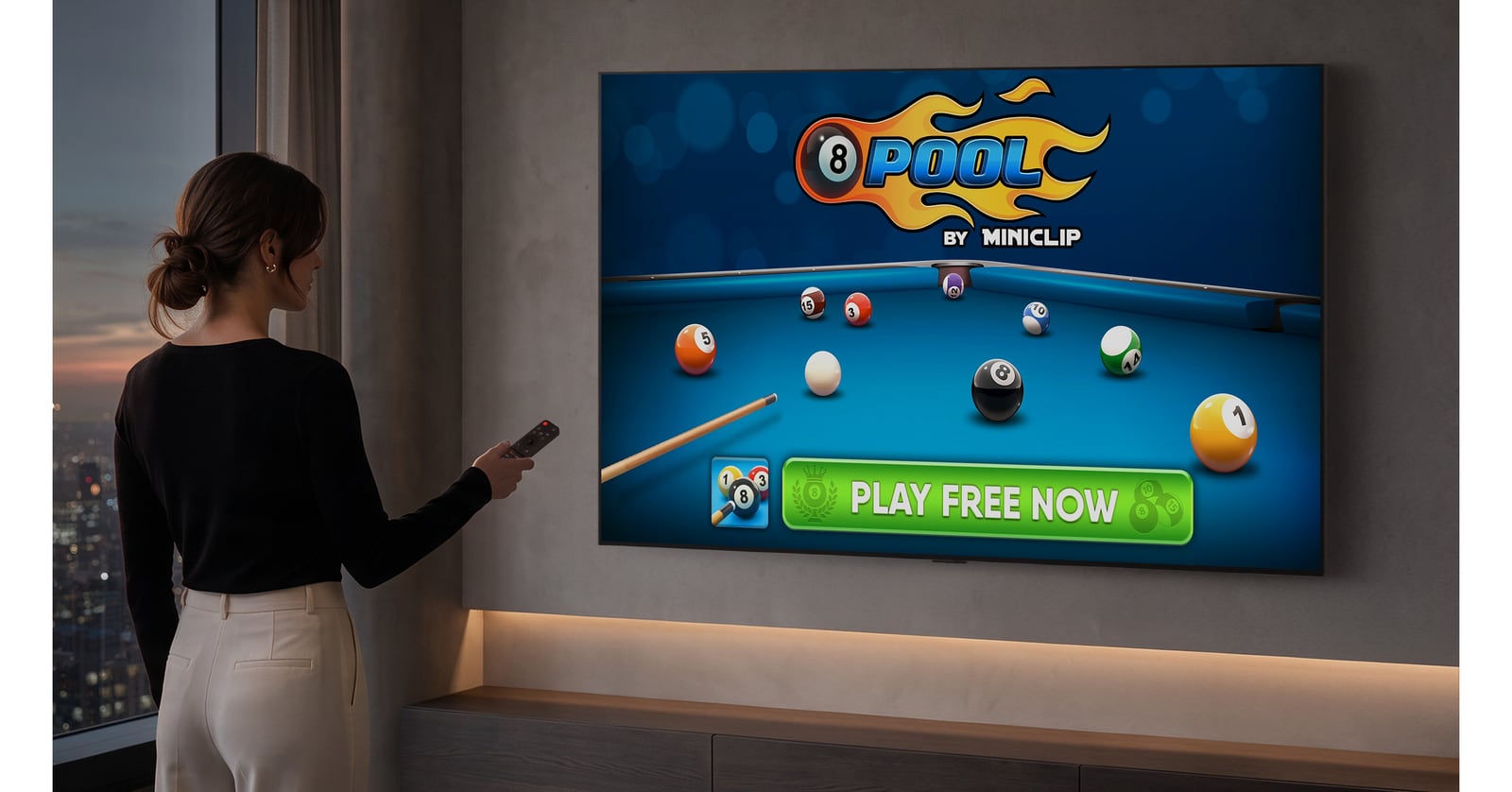 A person holds a remote beside a wall mounted television displaying 8 Ball Pool.